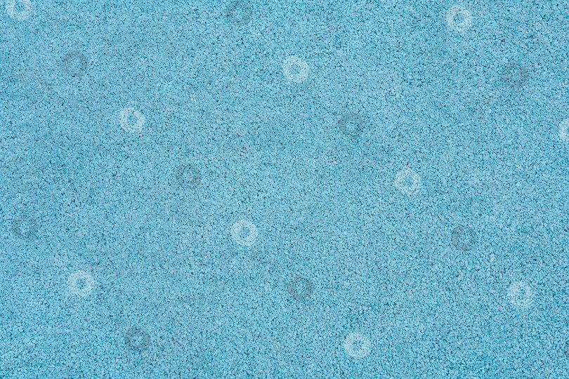Скачать Поверхность из синей резиновой крошки в качестве текстуры, фона фотосток Ozero