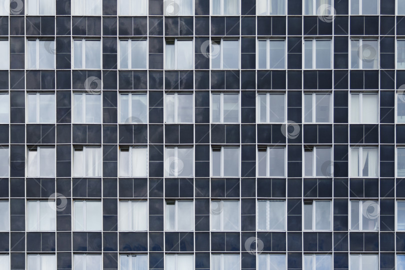 Скачать Вид спереди на фасад современного офисного здания в виде текстуры, фона, абстракции фотосток Ozero