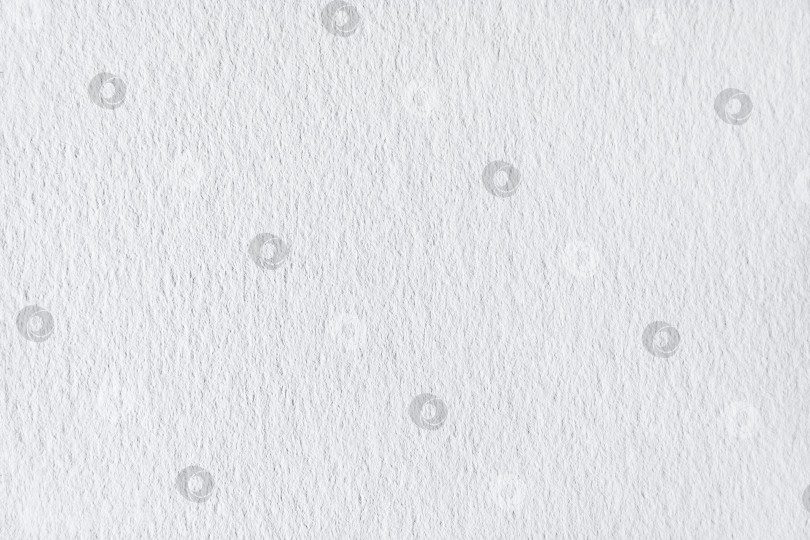 Скачать Зернистая поверхность белой бумаги в качестве текстуры, фона (крупный план, макросъемка) фотосток Ozero