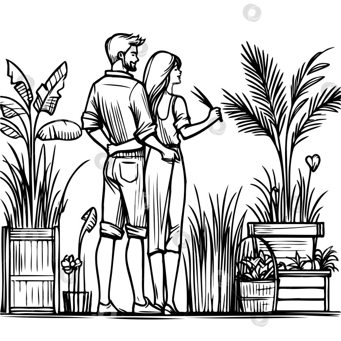 Скачать Мужчина и женщина прогуливаются по саду, рассматривая растения фотосток Ozero