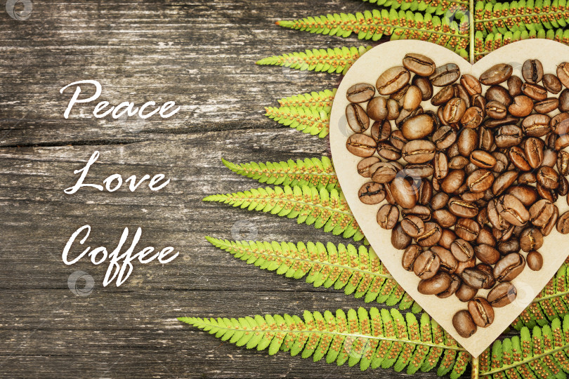 Скачать Цитата из кофейных зерен на деревянном экологически чистом фоне фотосток Ozero