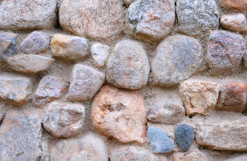 Скачать Стена из натурального камня. Абстрактная текстура камня. Закрыть. фотосток Ozero