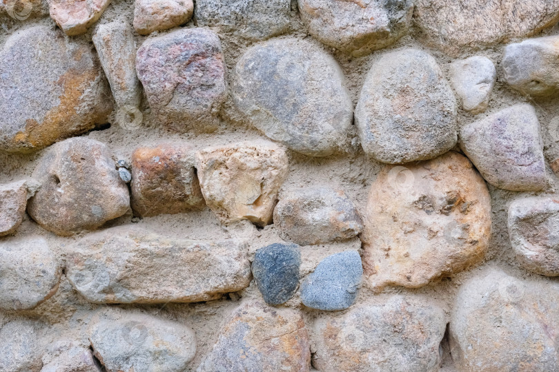 Скачать Стена из натурального камня. Абстрактная текстура камня. Закрыть. фотосток Ozero