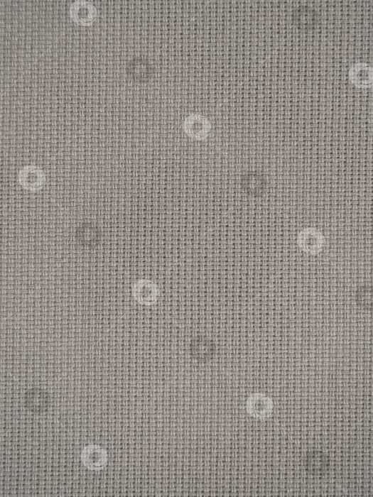 Скачать cotton waffle towels for the kitchen hang on hooks on a bracket against a white wall background фотосток Ozero