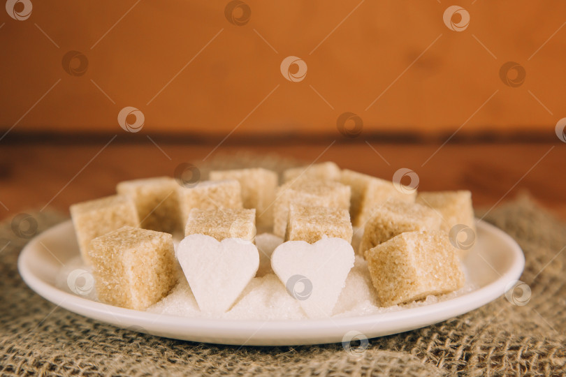 Скачать кубики сахара на черном фоне. Сахар - это нездоровая пища, которая приводит к ожирению, диабету, уходу за зубами. фотосток Ozero