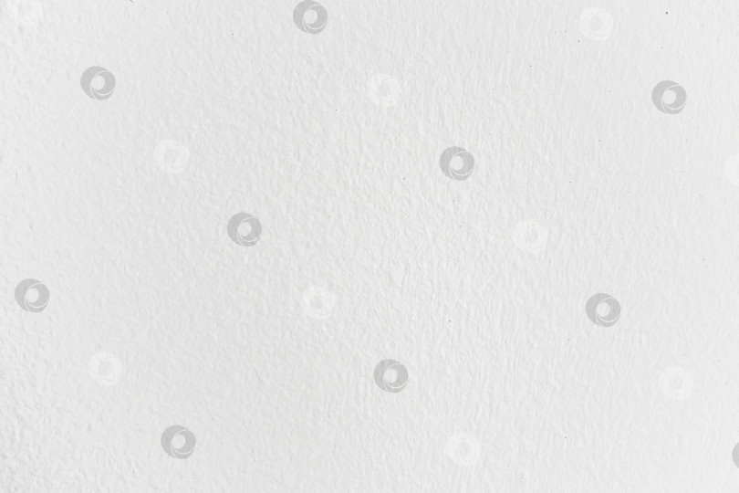 Скачать Текстурированная белая поверхность стены с едва заметными тенями фотосток Ozero