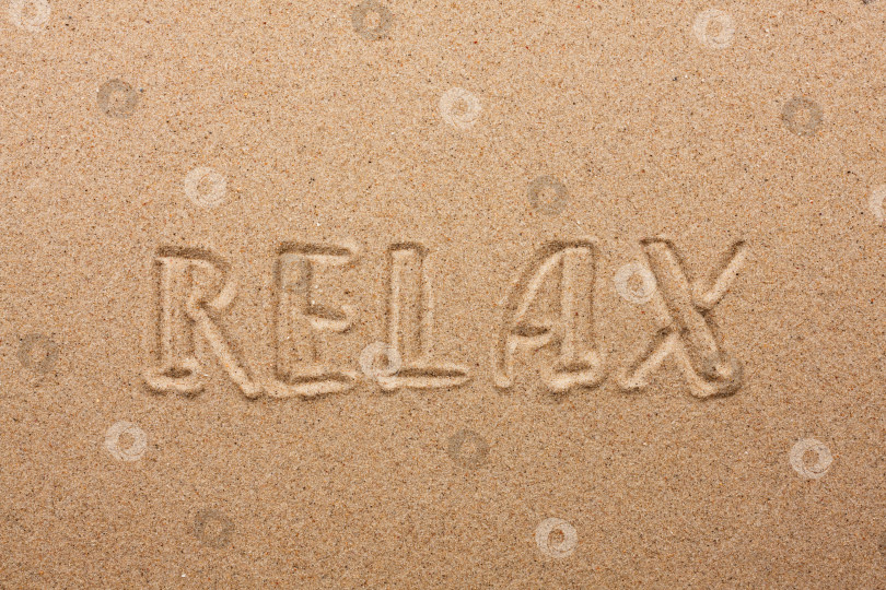 Скачать Надпись relax на песке фотосток Ozero