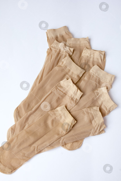 Скачать нейлоновые носки на белом фоне. очарование фотосток Ozero