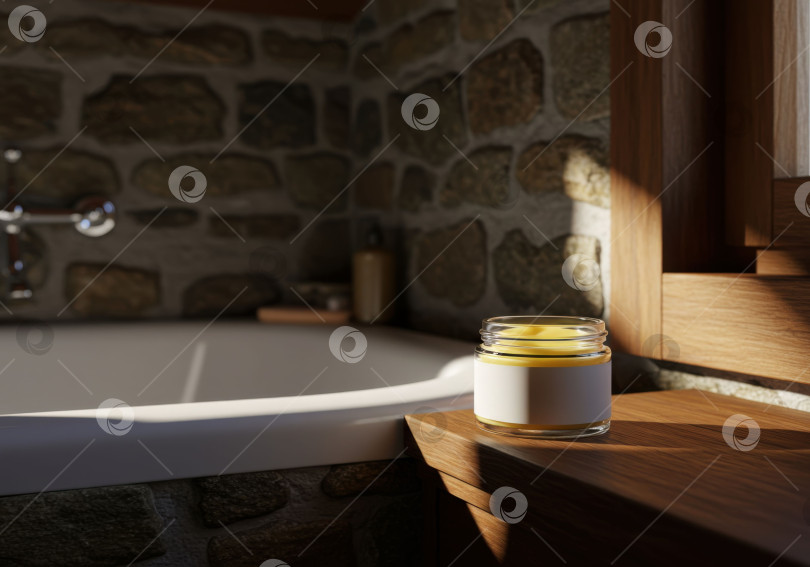 Скачать Желтый косметический крем в прозрачной баночке с белой этикеткой на деревянной поверхности рядом с белой ванной. фотосток Ozero