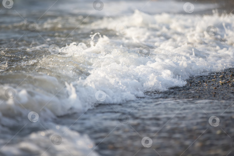 Скачать Белая пена морской волны крупным планом. фотосток Ozero