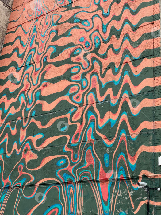 Скачать Психоделическая фреска с волнистыми линиями в ярких бирюзовых, розовых и оранжевых тонах, создающая абстрактный узор фотосток Ozero