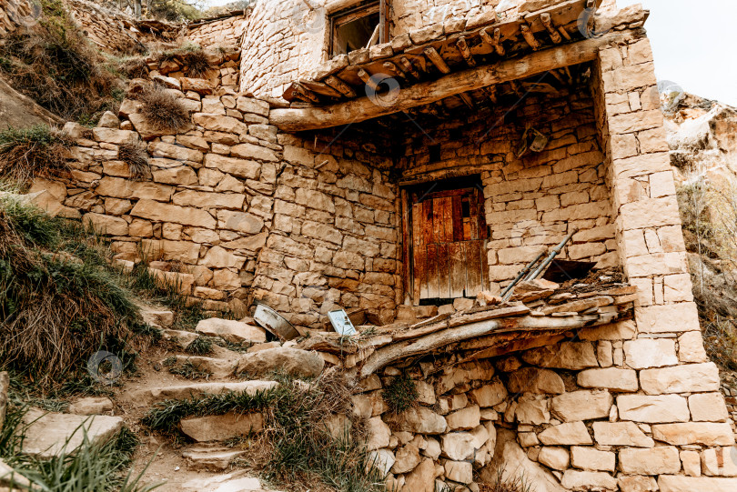 Скачать Старый город крепости Аул Гамсутль, старинная каменная достопримечательность архитектуры, Дагестан, Россия фотосток Ozero