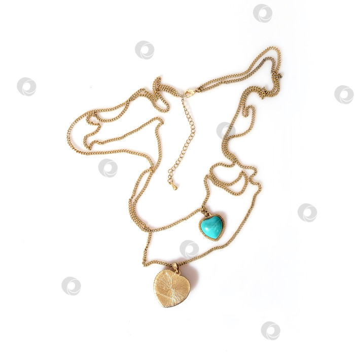 Скачать Золотое колье с бирюзой, выделяющейся на белом фоне фотосток Ozero