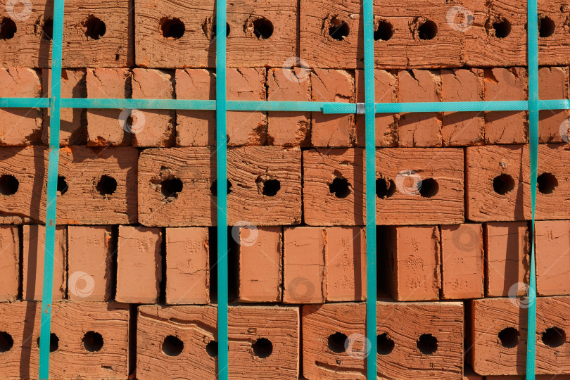 Скачать Фон и текстура. Кирпичные поддоны на строительной площадке фотосток Ozero