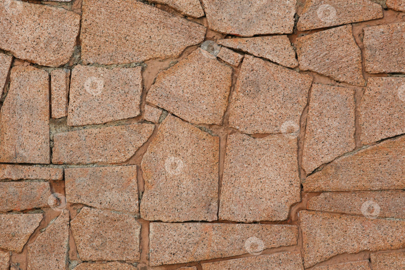 Скачать Естественная текстура и фон. Стена из кусочков колотого гранита фотосток Ozero