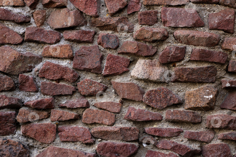 Скачать Это детальный вид кирпичной стены крупным планом, заполненной множеством кирпичей фотосток Ozero