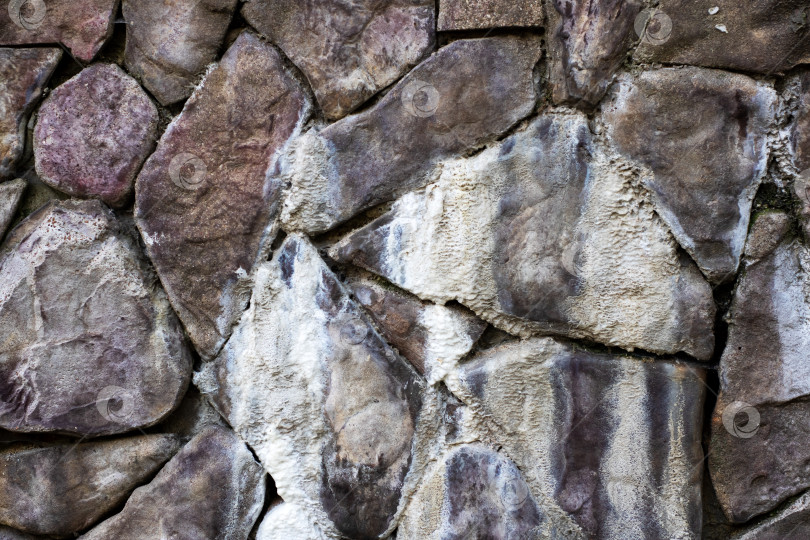 Скачать Текстура выветрившейся каменной стены - Фон из каменной кладки в деревенском стиле фотосток Ozero