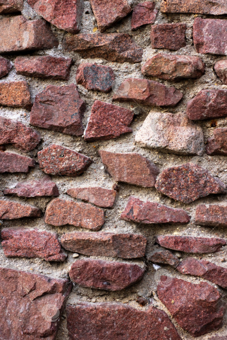Скачать Крупным планом красивая каменная стена, сложенная из красных камней фотосток Ozero