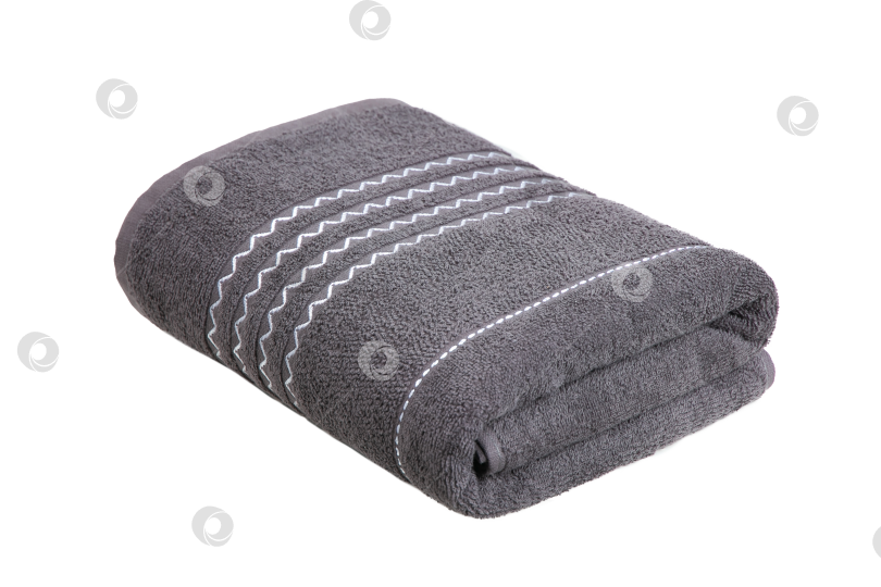 Скачать разноцветные махровые полотенца, свернутые в рулон и разложенные стопкой на столе фотосток Ozero