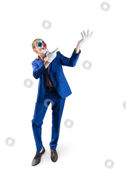 Скачать Мужчина в маске клоуна и деловом костюме. фотосток Ozero