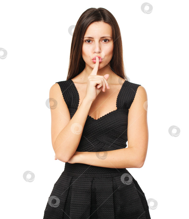 Скачать Молодая красивая женщина приложила указательный палец к губам в знак молчания фотосток Ozero
