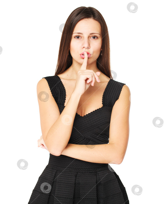 Скачать Молодая красивая женщина приложила указательный палец к губам в знак молчания фотосток Ozero