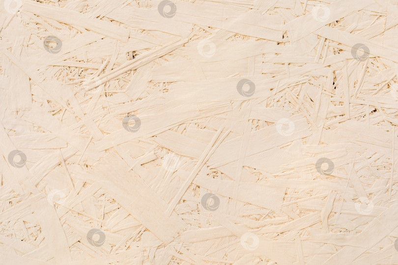 Скачать Фрагменты склеенных досок из древесной стружки. ДСП бежевого цвета, текстура дерева. фотосток Ozero