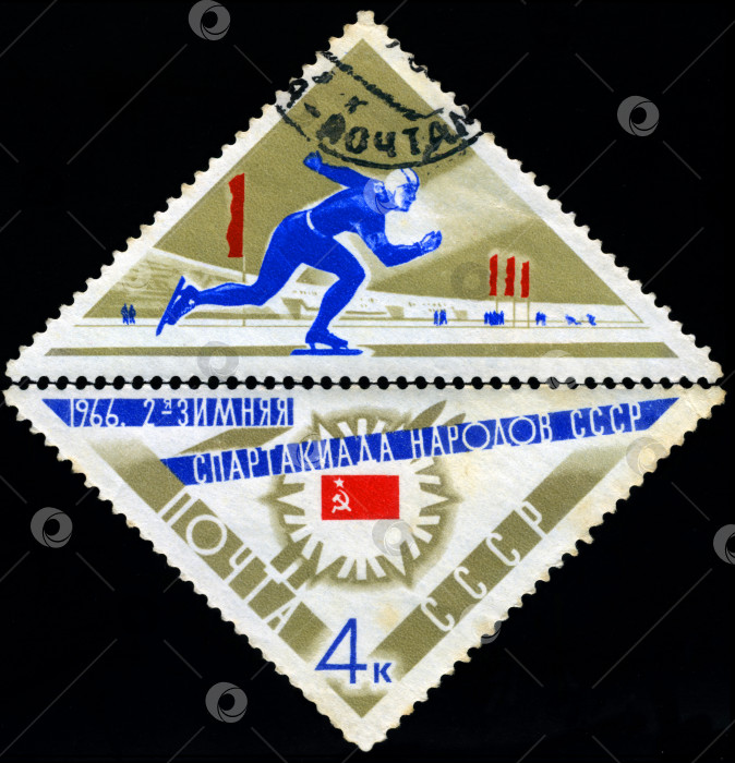 Скачать СССР - ОКОЛО 1966 года: На почтовой марке, напечатанной в СССР, изображен фигурист, серия посвящена Зимним играм народов СССР, около 1966 года. фотосток Ozero