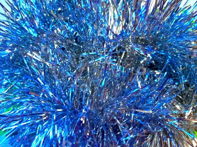 Скачать Серебристо-голубая мишура крупным планом фотосток Ozero