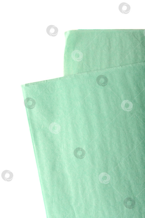 Скачать Листы мятно-зеленой папиросной бумаги для упаковки цветов. Мягкая тонкая упаковочная бумага пастельных тонов, также известная как морская пена, аквамарин и светло-бирюзовый, для флористики. фотосток Ozero