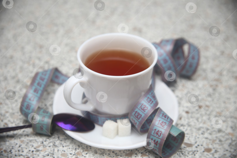 Скачать Чашка черного кофе и сантиметровая лента фотосток Ozero