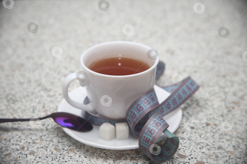 Скачать Чашка черного кофе и сантиметровая лента фотосток Ozero