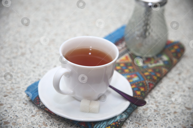 Скачать Чашка черного кофе и  куски сахара фотосток Ozero