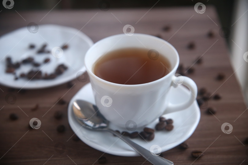 Скачать Кофе с кофейными зернами в чашке фотосток Ozero