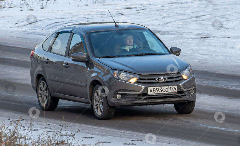 Скачать Россия,Сибирь 27 Мая 2025 год. Автомобиль Lada Granta FL. фотосток Ozero