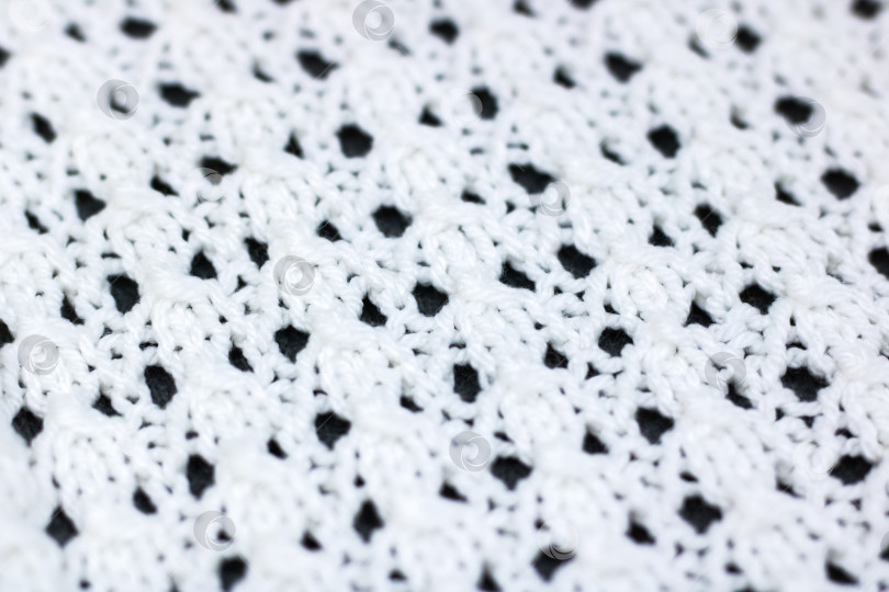 Скачать Тщательный осмотр подчеркивает мастерство исполнения и текстурные узоры в хлопчатобумажной ткани, вязаной крючком фотосток Ozero