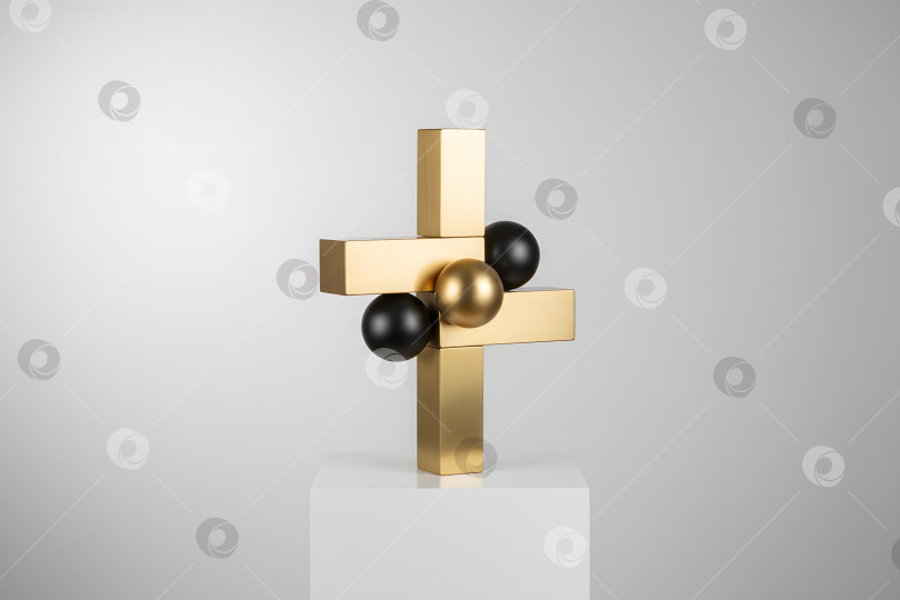 Скачать Скульптура с геометрическими фигурами и цветными сферами на белом пьедестале в студийной обстановке фотосток Ozero