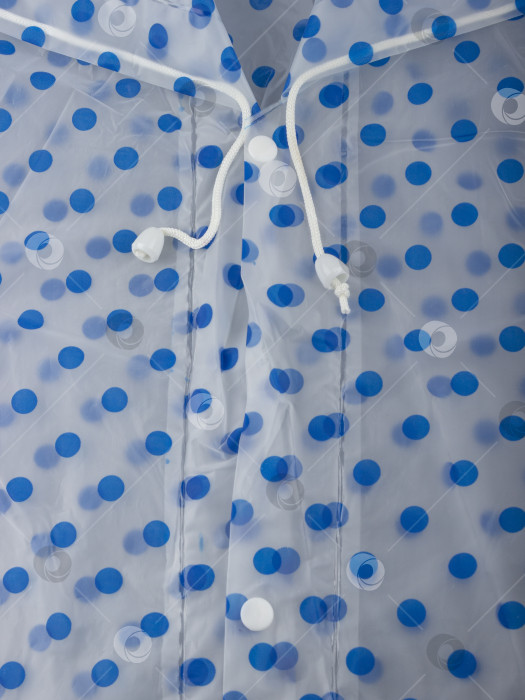 Скачать Белые завязки и пуговицы прозрачного синего плаща в горошек крупным планом фотосток Ozero