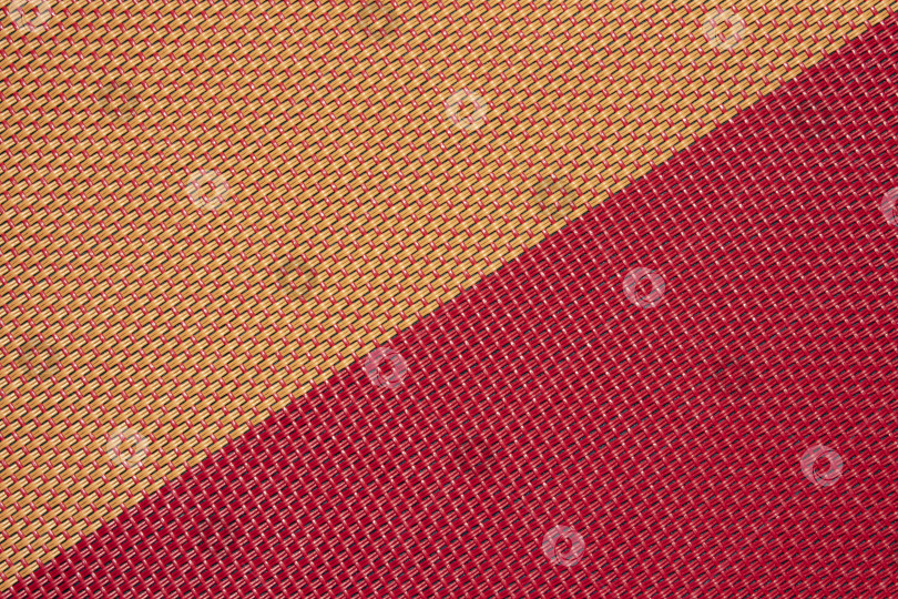 Скачать Текстура выполнена из соломы. Фон из соломенного переплетения.Текстура цветной плетеной соломы.Текстура плетеной соломы. фотосток Ozero