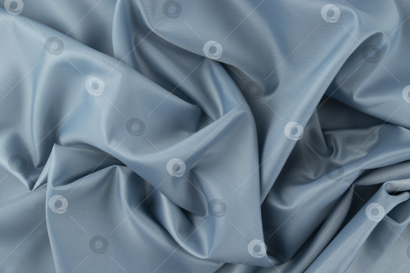 Скачать Крупный план светло-голубого полотна с фактурной тканью и тонкими складками фотосток Ozero