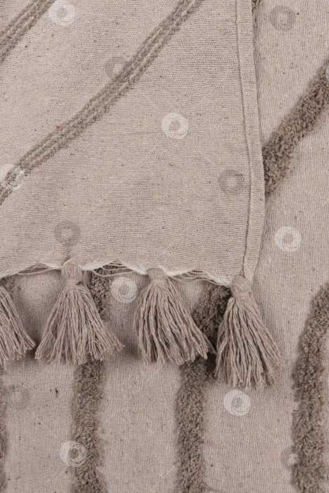 Скачать Крупный план на фоне пледа с кисточками фотосток Ozero