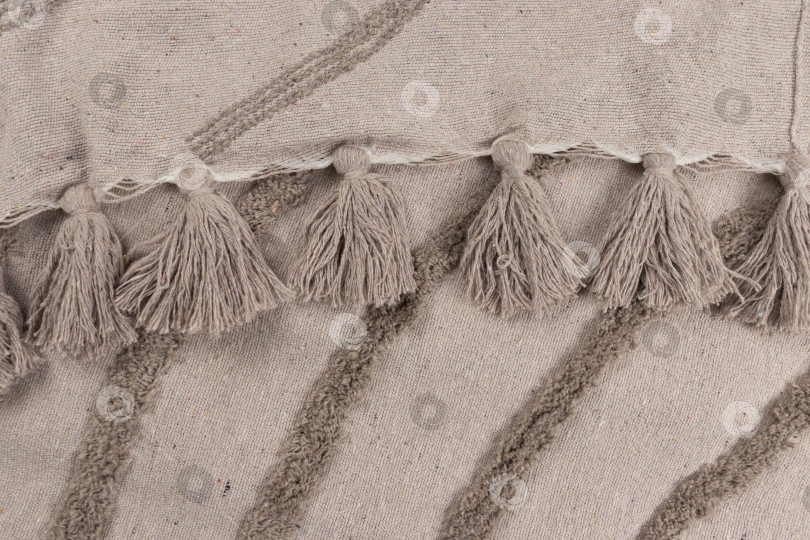 Скачать Крупный план края пледа с кисточками фотосток Ozero