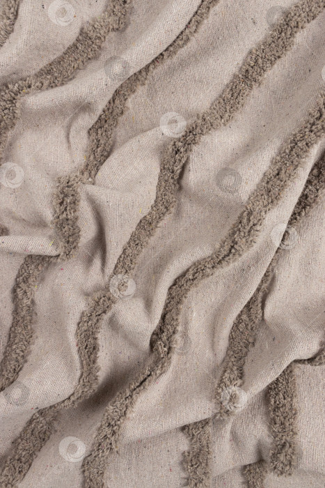 Скачать Сложенный бежевый материал с фактурой орнамента фотосток Ozero