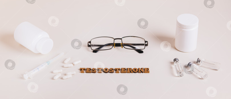 Скачать Веб-баннер шприца, ампул и капсул для регулирования уровня тестостерона фотосток Ozero