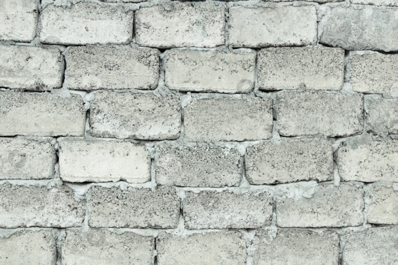 Скачать Грубая кирпичная стена с неровной фактурой кладки фотосток Ozero