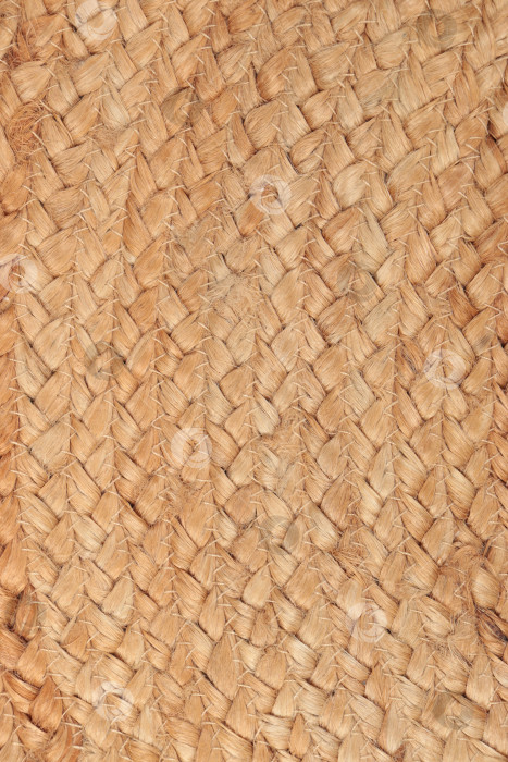 Скачать Крупный план плетеного из натуральных волокон джутового ковра в деревенском стиле, идеально подходящего для фона и элементов дизайна фотосток Ozero