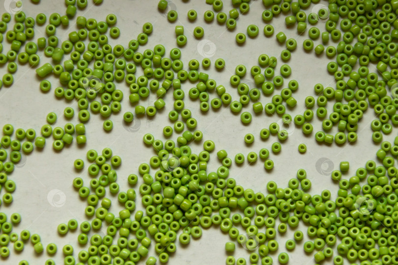 Скачать Фон из зеленых бусин крупным планом фотосток Ozero