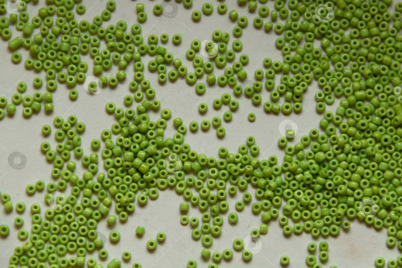 Скачать Фон из зеленых бусин крупным планом фотосток Ozero