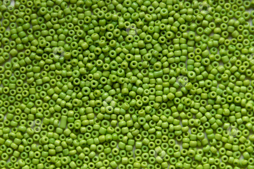 Скачать Фон из зеленых бусин крупным планом фотосток Ozero