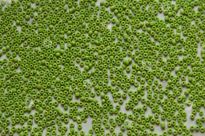 Скачать Фон из зеленых бусин крупным планом фотосток Ozero